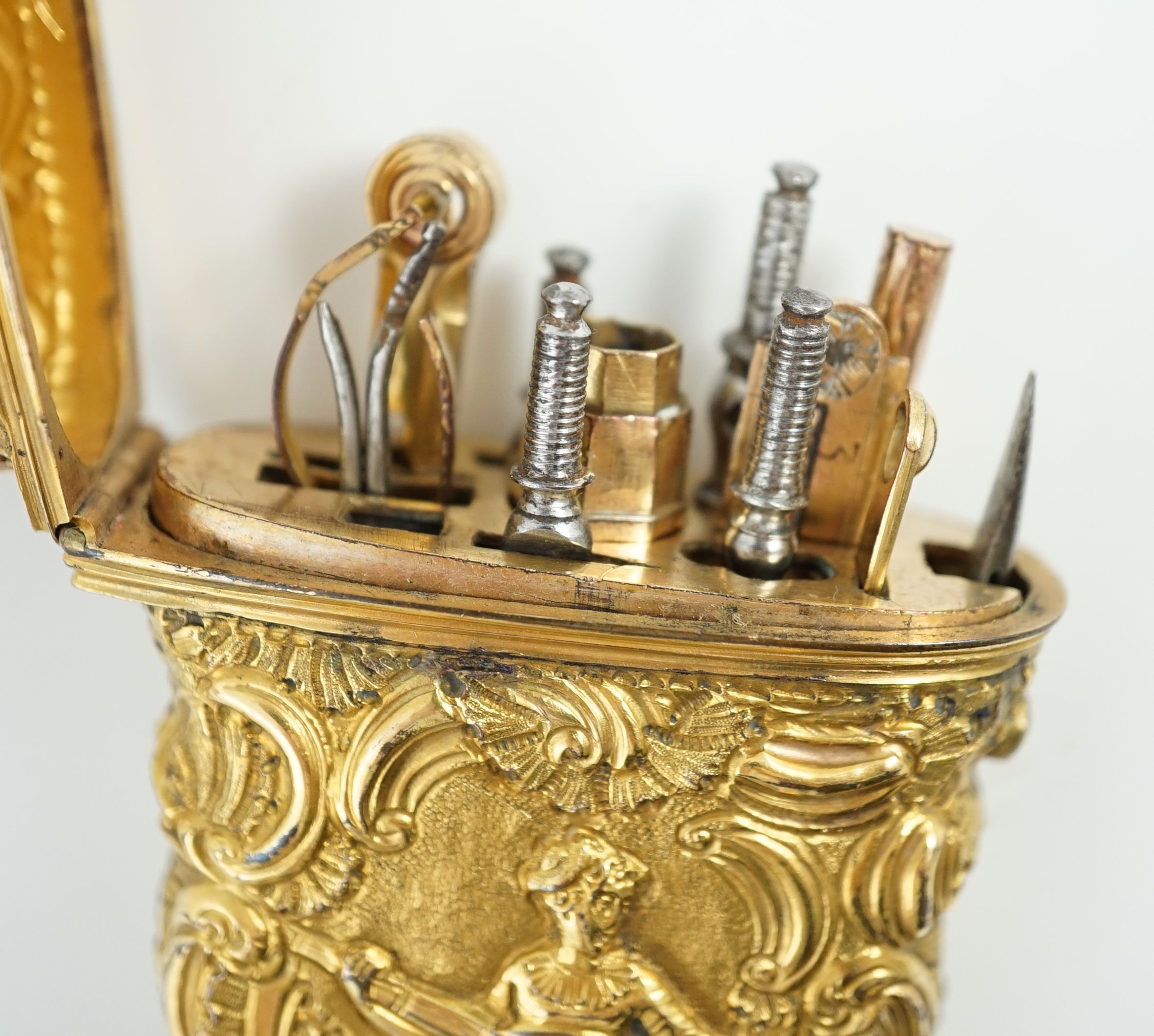 A George III gilt metal etui containing accessories, 10cms high.